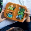 A child's hands holding an open Minecraft-themed lunch box. Produktbild-Vorschau