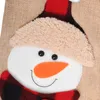 Close-up of a snowman's face on a burlap background. Produktbild-Vorschau
