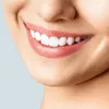 A close-up of a person's mouth smiling, showing their teeth and lips. Anteprima dell’immagine prodotto