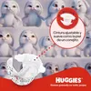 A marketing image featuring cartoon bunnies and a Huggies diaper, highlighting product features. Náhled obrázku produktu