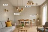 A modern dining room and living room area with various lighting fixtures. Produktbild-Vorschau