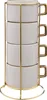 A stack of four white ceramic mugs with gold handles, displayed in a gold wire rack. Podgląd zdjęcia produktu