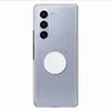 A clear case for a Samsung Galaxy Z Fold 5 with a white circular accessory attached to the back. Produktbild-Vorschau