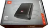 The image shows the packaging of a JBL Bass Pro Nano subwoofer. Voir les images du produit