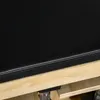 A close-up view of the black padded seat and wooden frame of a weight bench. Náhľad obrázku produktu