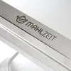 A close-up view of a stainless steel surface with a logo and text etched into it. Voir les images du produit