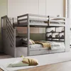 A gray bunk bed with stairs and storage drawers in a room. Voir les images du produit