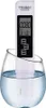 A digital TDS meter is submerged in a glass of water. Náhled obrázku produktu