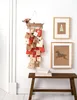 A wall decorated with a dachshund-shaped advent calendar and two framed pictures. Anteprima dell’immagine prodotto