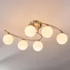 A close-up shot of a ceiling light fixture with six glass globes. Produktbild-Vorschau