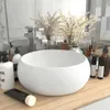 A bathroom sink and toiletries on a wooden counter. Podgląd zdjęcia produktu
