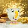 A Chip mug from Beauty and the Beast is displayed with various baked goods in the foreground and a bokeh background. Anteprima dell’immagine prodotto