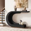 A black C-shaped console table with decorative vases and a lamp, placed near a staircase. Anteprima dell’immagine prodotto