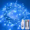 A tangled string of blue LED lights with a USB connector and a remote control. Produktbild-Vorschau