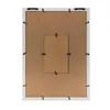 The back of a white picture frame with a brown backing board. Produktbild-Vorschau
