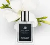 A bottle of Acca Kappa Muschio Bianco Eau de Parfum is displayed in front of white flowers. Náhled obrázku produktu