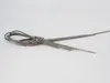 A bundle of metal wires tied together with a knot, lying on a white background. Produktbild-Vorschau