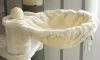 A close-up view of a cat tree hammock with a sisal ball on top. Produktbild-Vorschau