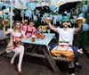 People celebrating Oktoberfest with beer and pretzels. Voir les images du produit