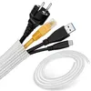 A collection of electronic cables and a cable management sleeve. Produktbild-Vorschau
