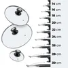 A size chart showing various sizes of glass pot lids with black handles, alongside a stack of two larger lids. Anteprima dell’immagine prodotto