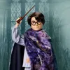 A doll of Harry Potter in pajamas and a starry cloak, holding a wand. Podgląd zdjęcia produktu