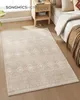 A rug is placed on a wooden floor next to a bed and a nightstand in a bedroom. Produktbild-Vorschau