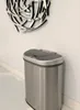 A stainless steel trash can with a gray lid is shown against a white wall. Anteprima dell’immagine prodotto