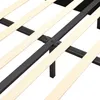 A close-up view of a bed frame's wooden slats and metal support structure. Voir les images du produit