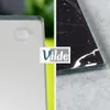 A split image showing two different cutting boards, one white and one black marble pattern, with a logo overlay. Náhľad obrázku produktu