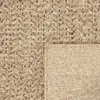 A close-up view of a woven rug, showing its texture and pattern. The rug is folded in one corner, revealing the underside. Produktbild-Vorschau