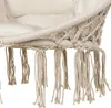 Close-up of the fringe and woven detail of a hanging chair. Voir les images du produit