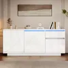 A modern white sideboard with LED lighting in a living room setting. Anteprima dell’immagine prodotto