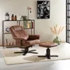 A brown leather-look recliner chair and ottoman are placed on a fluffy white rug in a living room setting. A black metal shelf unit with decorative items and books is behind the chair. A framed black and white picture of gears hangs on the wall. Produktbild-Vorschau