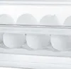 A close-up view of white eggs in a clear plastic egg holder. Náhled obrázku produktu