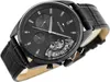 A close-up studio shot of a black Tommy Hilfiger men's watch with a black leather strap, presented against a white background. Produktbild-Vorschau