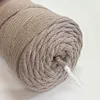 A close-up view of a roll of beige braided cord. Podgląd zdjęcia produktu
