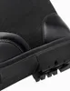 Close-up view of the sole and lower part of a black boot. Produktbild-Vorschau