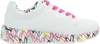 A side view of a white sneaker with a colorful heart-shaped graffiti design on the sole and lining, and pink laces. Podgląd zdjęcia produktu