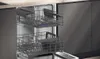 The image shows the interior of an open dishwasher with two racks extended. Produktbild-Vorschau