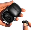 A hand holding a black Urbanista Porto Series TWS earbud case with one earbud being held by fingers. Náhľad obrázku produktu