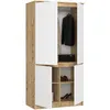 A tall, narrow wardrobe with two sections, each with two doors. The top section has a hanging rod and a black box. The bottom section has shelves with shoes. Anteprima dell’immagine prodotto