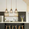 A modern kitchen island with pendant lights hanging above it. Anteprima dell’immagine prodotto