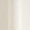 A close-up of textured white wallpaper. Produktbild-Vorschau