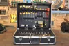 A tool case filled with various tools, set against a workshop background. Produktbild-Vorschau