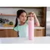 A young girl is holding a pink bottle in a kitchen setting. Anteprima dell’immagine prodotto