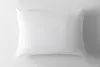 A white pillow is shown from a top-down perspective on a white background. Produktbild-Vorschau