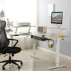 An L-shaped standing desk with office equipment. Voir les images du produit
