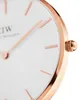 A close-up shot of a watch face and crown. Voir les images du produit