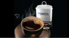 A cup of coffee next to a Brita water filter. Náhled obrázku produktu